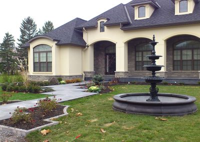 Formal front yard with fountain