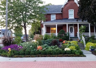 Front yard garden design with mix of veggies and ornamentals