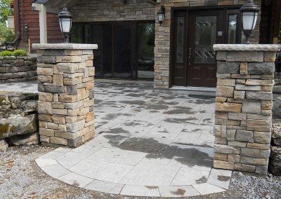 Square cut limestone patio and entrance posts