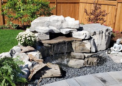 Weathered limestone boulder water feature
